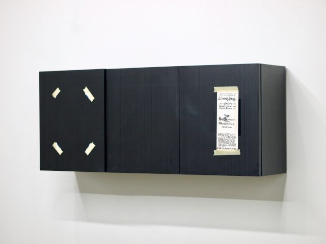 Kaz Oshiro, Three door cabinet (Black woodgrain, tape and flyer), 2014, Courtesy of the artist and Maki Gallery