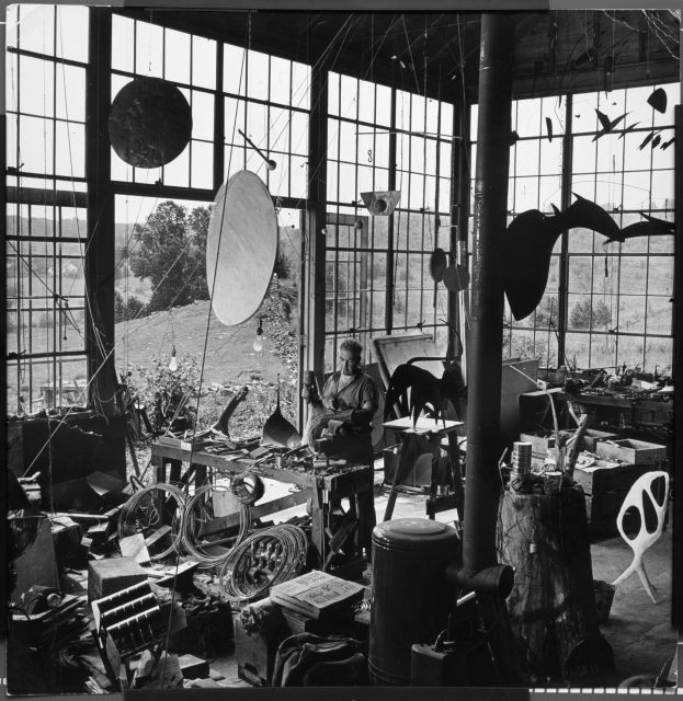 Calder with Red Disc and Gong (1940) and Untitled (c. 1940) in his Roxbury studio, 1944. Photograph by Eric Schaal © Life Magazine